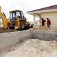 A worker uses heavy machinery to level the ground at the construction site within the Greenpark estate in Lukenya, near Kenya's capital Nairobi, October 31, 2014.  REUTERS/Thomas Mukoya