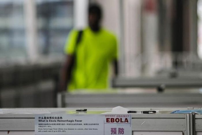 Health warnings about the Ebola virus are displayed at the entrance of the Canton Fair in Guangzhou, Guangdong province, October 26, 2014. REUTERS/Alex Lee