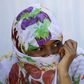 A migrant woman from Somalia covers her face with a scarf at a transit camp in Gevgelija, Macedonia, after entering the country by crossing the border with Greece, September 12, 2015. REUTERS/Ognen Teofilovski