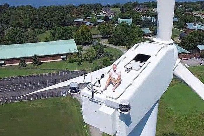 Drone catches man on top of a 200ft wind turbine