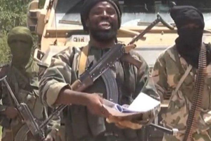 Boko Haram leader, who is rumoured to have been killed, is flanked by his fellow terrorists.