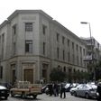 People and vehicles are seen caught in a traffic jam in front of the Central Bank of Egypt's headquarters in downtown Cairo March 17, 2013.REUTERS/Amr Abdallah Dalsh