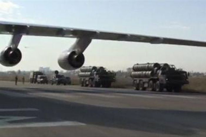 A frame grab taken from footage released by Russia"s Defence Ministry November 26, 2015, shows Russian S-400 defense missile systems (R) driving on the tarmac of Hmeymim airbase in Syria.