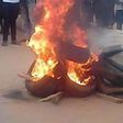 Angry mob burn man accused of stabbing neighbour to death
