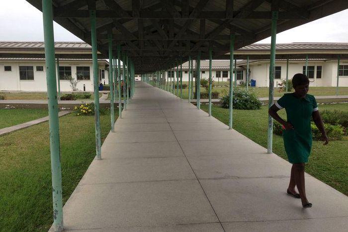 A lone nurse walks through Winneba Trauma and Specialist Hospital in Winneba, Ghana, August 20, 2015. Doctors in Ghana will suspend a three-week strike they called to press for better conditions of service, the Ghana Medical Association (GMA) said on A...