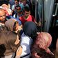 Hundreds of migrants board Hungarian buses at Croatian border