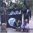 Screen shot from Boko Haram video showing amputation of two men's hands