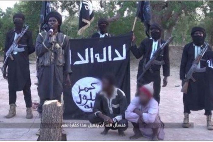 Screen shot from Boko Haram video showing amputation of two men's hands
