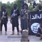 Screen shot from Boko Haram video showing amputation of two men's hands