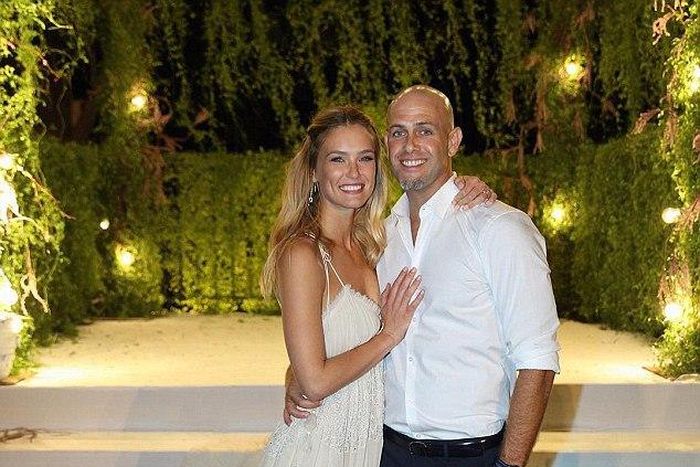 Bar Refaeli gave fans a glimpse of her big day by sharing an official photo of her posing with new husband right after tying the knot