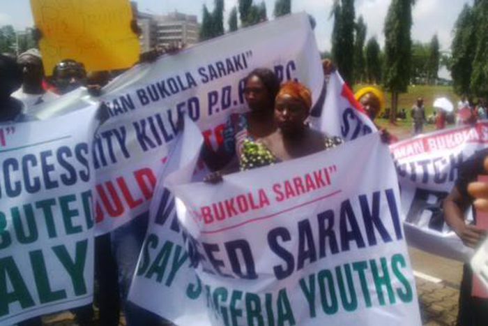 Supporters of Senate President, Bukola Saraki protest outside the National Assembly in Abuja on September 29, 2015