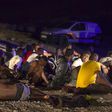 African migrants rest after arriving on a fishing boat at Las Carpinteras beach in the Canary Island of Gran Canaria, Spain, September 1, 2015. REUTERS/Borja Suarez