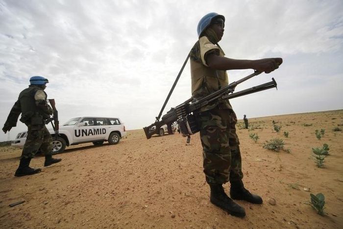 UNAMID peacekeepers stand guard as a delegation of Ambassadors of European Union to Sudan visits a women development program centre funded by World Food Programme (WFP) at Shagra village in North Darfur October 18, 2012. REUTERS/Mohamed Nureldin Abdall...