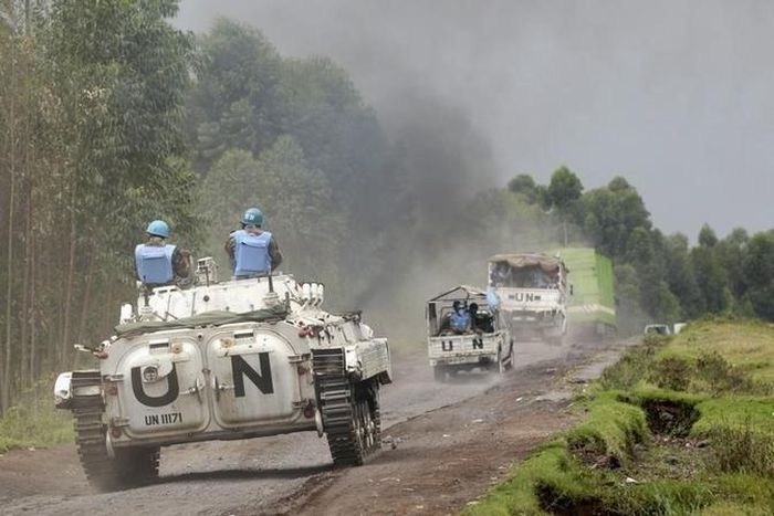 U.N. peacekeepers drive their tank as they patrol past the deserted Kibati village near Goma in the eastern Democratic Republic of Congo, August 7, 2013. REUTERS/Thomas Mukoya