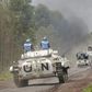U.N. peacekeepers drive their tank as they patrol past the deserted Kibati village near Goma in the eastern Democratic Republic of Congo, August 7, 2013. REUTERS/Thomas Mukoya