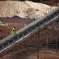 A worker works at the Lauzoua manganese mine, some 180 km (112 miles) from Abidjan December 4, 2013. REUTERS/Thierry Gouegnon
