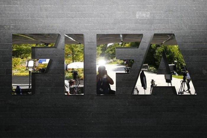 The logo of FIFA is seen in front of its headquarters in Zurich, Switzerland July 20, 2015. REUTERS/Arnd Wiegmann