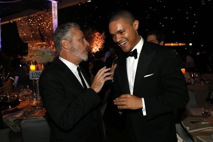 Television personality Jon Stewart (L) talks with actor Trevor Noah at the 67th Annual Primetime Emmy Awards Governors Ball in Los Angeles, California September 20, 2015. REUTERS/Mario Anzuoni