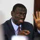 Kizza Besigye, leader of opposition party Forum for Democratic Change (FDC), gestures as he speaks to the media announcing his candidature for the 2016 presidential election in the capital Kampala September 25, 2015. REUTERS/James Akena