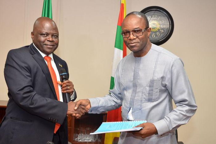 Dr. Emmanuel Ibe Kachikwu (R), the new managing director of the Nigerian National Petroleum Corp (NNPC), shakes hands with the former Group Managing Director of NNPC, Dr. Joseph Thlama Dawha during a handover ceremony in Abuja, Nigeria, in this August ...