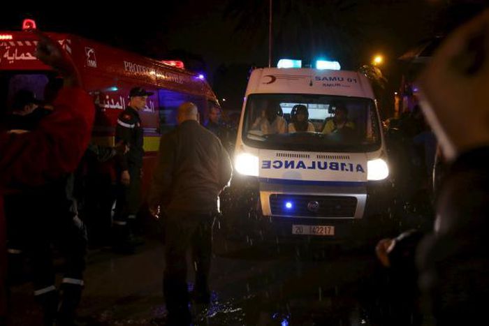 Police help to make way for an ambulance carrying bodies after an attack on a military bus in Tunis, Tunisia November 24, 2015. 