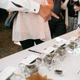 Guests browse the marijuana bar at the Elledge-Alexander wedding earlier this summer.