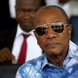 Guinea's outgoing president and presidential candidate Alpha Conde, leader of Rassemblement du Peuple de Guinea (RPG), attends the inauguration ceremony of the passenger harbor of Sandervalia in Conakry October 8, 2015. REUTERS/Luc Gnago