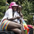 A lesbian couple laughs during the third annual gay pride celebrations by members of the lesbian, gay, bisexual and transgender (LGBT) community in Entebbe, southwest of Uganda"s capital Kampala, August 8, 2015.