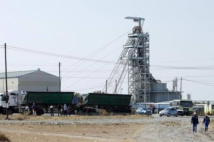 Workers leave Lonmin's Karee mine at the end of their shift, outside Rustenburg, northwest of Johannesburg July 29, 2015. REUTERS/Siphiwe Sibeko