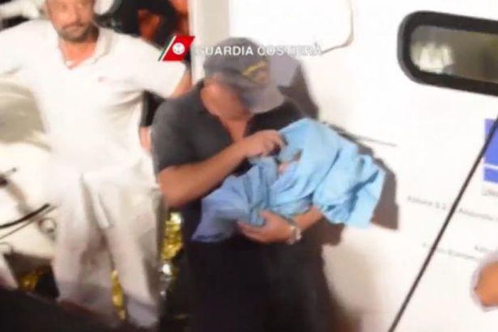 Heavily pregnant Nigerian woman gives birth seconds after being rescued from sinking migrant boat