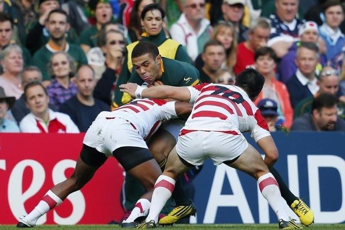 South Africa's Bryan Habana in action with Japan's Kotaro Matsushima (L) and Kosei Ono Reuters / Eddie Keogh Livepic