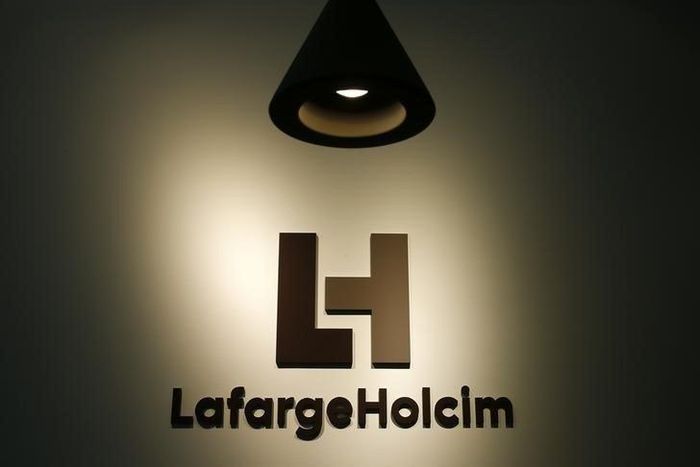 The company's new logo is pictured at the headquarters of LafargeHolcim in Zurich, Switzerland, July 15, 2015. REUTERS/Arnd Wiegmann