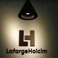 The company's new logo is pictured at the headquarters of LafargeHolcim in Zurich, Switzerland, July 15, 2015. REUTERS/Arnd Wiegmann