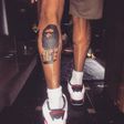 Chris Brown shows off his latest leg tattoos