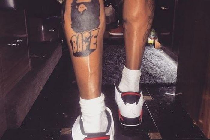 Chris Brown shows off his latest leg tattoos