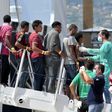 Migrants disembark from Italian Coast Guard vessel "Diciotti" in the Sicilian harbour of Palermo, Italy, August 20, 2015. REUTERS/Guglielmo Mangiapane