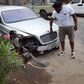 Timaya with his bashed Bentley