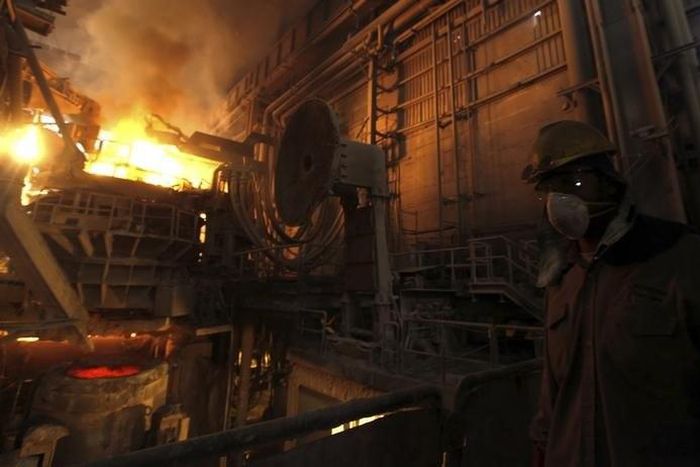 A worker operates a furnace at a factory belonging to Ezz Steel, Egypt's largest steel producer, at an industrial complex in Sadat City, 94 km (58 miles) north of Cairo, April 17, 2013. REUTERS/Amr Abdallah Dalsh