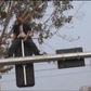 Drunk man shows off martial arts skills on a traffic light pole