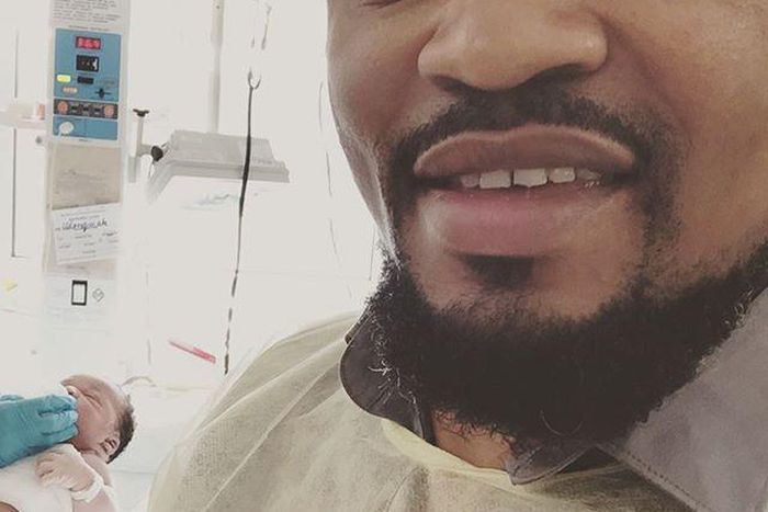 Moses Inwang with his son at the background