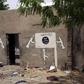 A wall painted by Boko Haram is pictured in Damasak, Nigeria March 24, 2015. REUTERS/Joe Penney