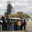 Miners gather near the Anglo American Platinum's Thembelani mine near the mining town of Rustenburg, northwest of Johannesburg September 30, 2013. REUTERS/Siphiwe Sibeko