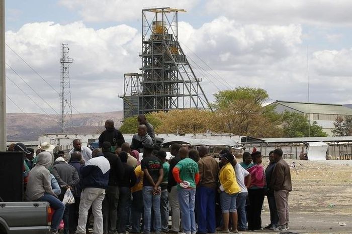 Miners gather near the Anglo American Platinum's Thembelani mine near the mining town of Rustenburg, northwest of Johannesburg September 30, 2013. REUTERS/Siphiwe Sibeko