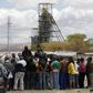 Miners gather near the Anglo American Platinum's Thembelani mine near the mining town of Rustenburg, northwest of Johannesburg September 30, 2013. REUTERS/Siphiwe Sibeko