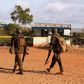 Kenya Defence Forces soldiers walk near the scene of an overnight attack on a residential complex in Mandera town at the Kenya-Somalia border July 7, 2015. REUTERS/Stringer
