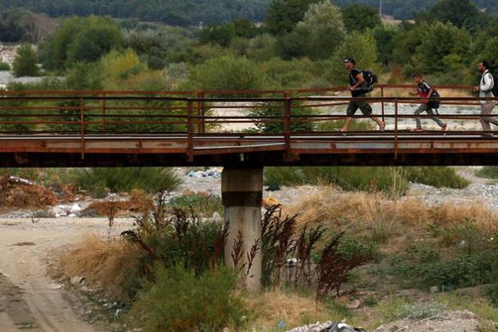 Crush at Macedonian border as migrants, refugees press to enter- witness