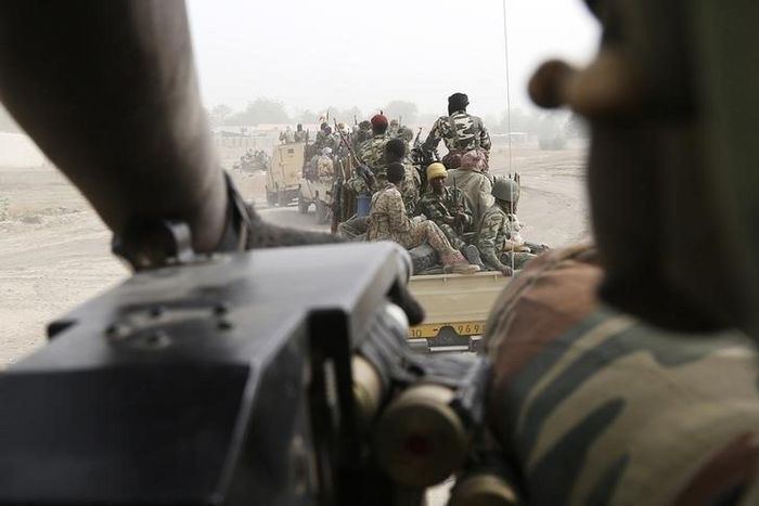 Chadian soldiers drive near the front line during battle against insurgent group Boko Haram in Gambaru, February 26, 2015.   REUTERS/Emmanuel Braun