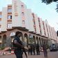 A Malian police officer stands guard in front of the Radisson hotel in Bamako, Mali, November 20, 2015. REUTERS/Joe Penney