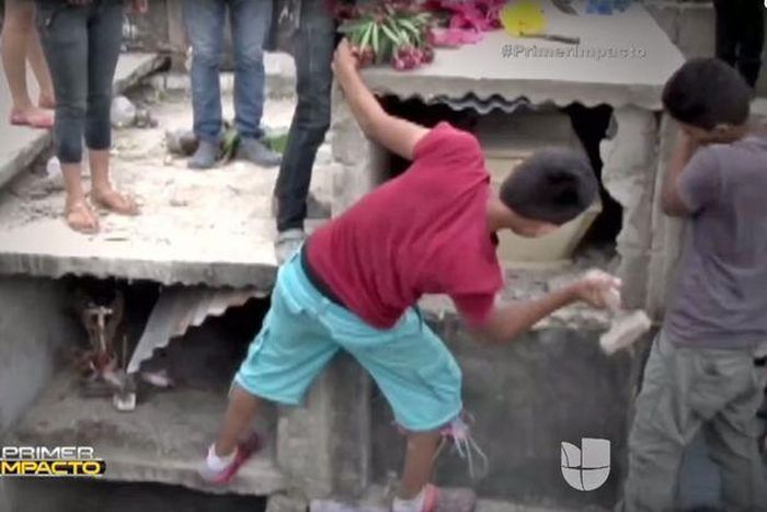 Relatives of the deceased smashing into her tomb after claiming to hear her screaming for help