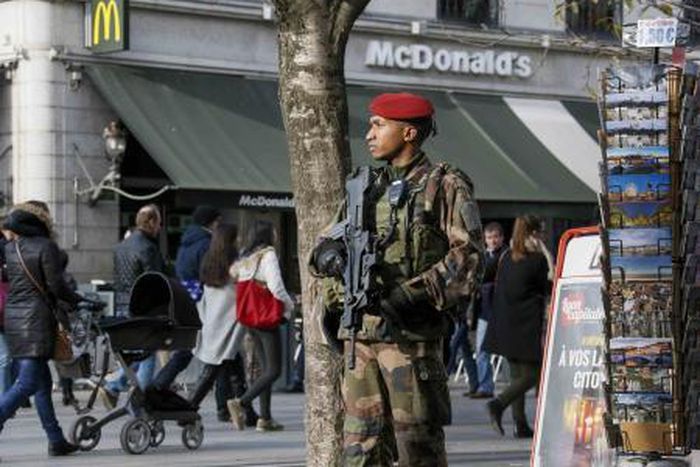 A French paratrooper patrols in the center of Lyon, France, November 27, 2015.